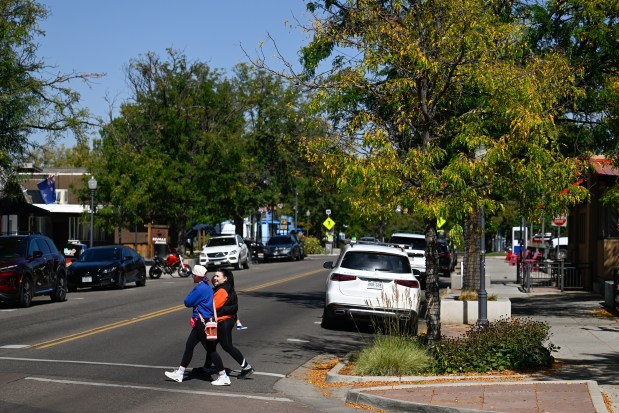 Pedestrians cross North Public Road from East Simpson Street in Lafayette on Thursday, Oct. 3, 2024. The city is forming a Downtown Development Authority. (Matthew Jonas/Staff Photographer)