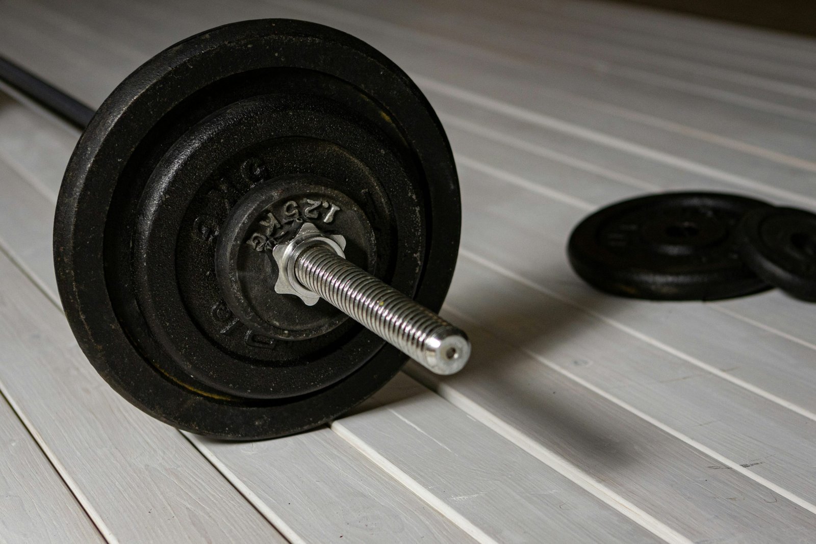 A person riding an indoor spin bike at a fitness studio.