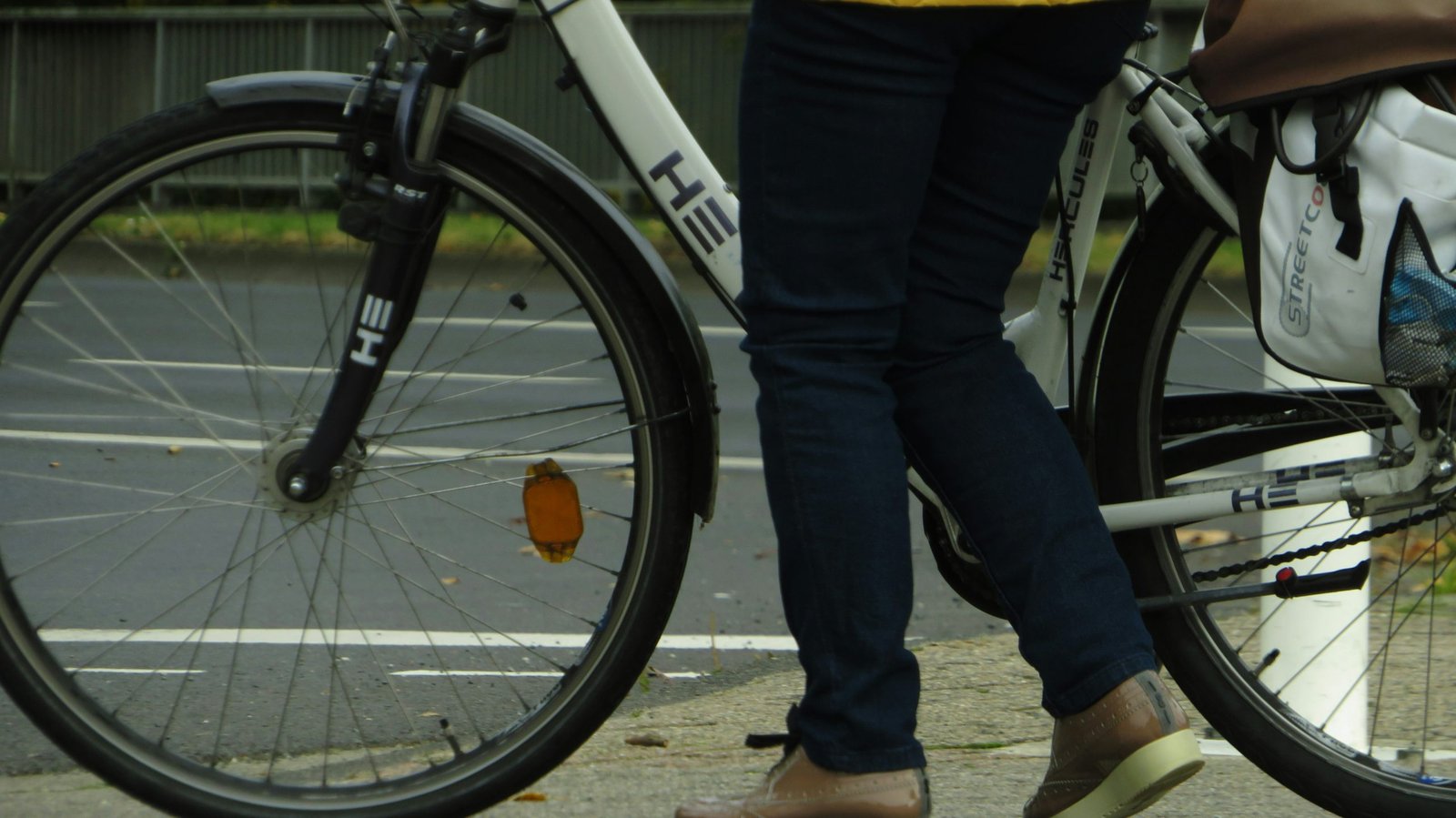 Before and after photos of Sarah standing next to her bicycle