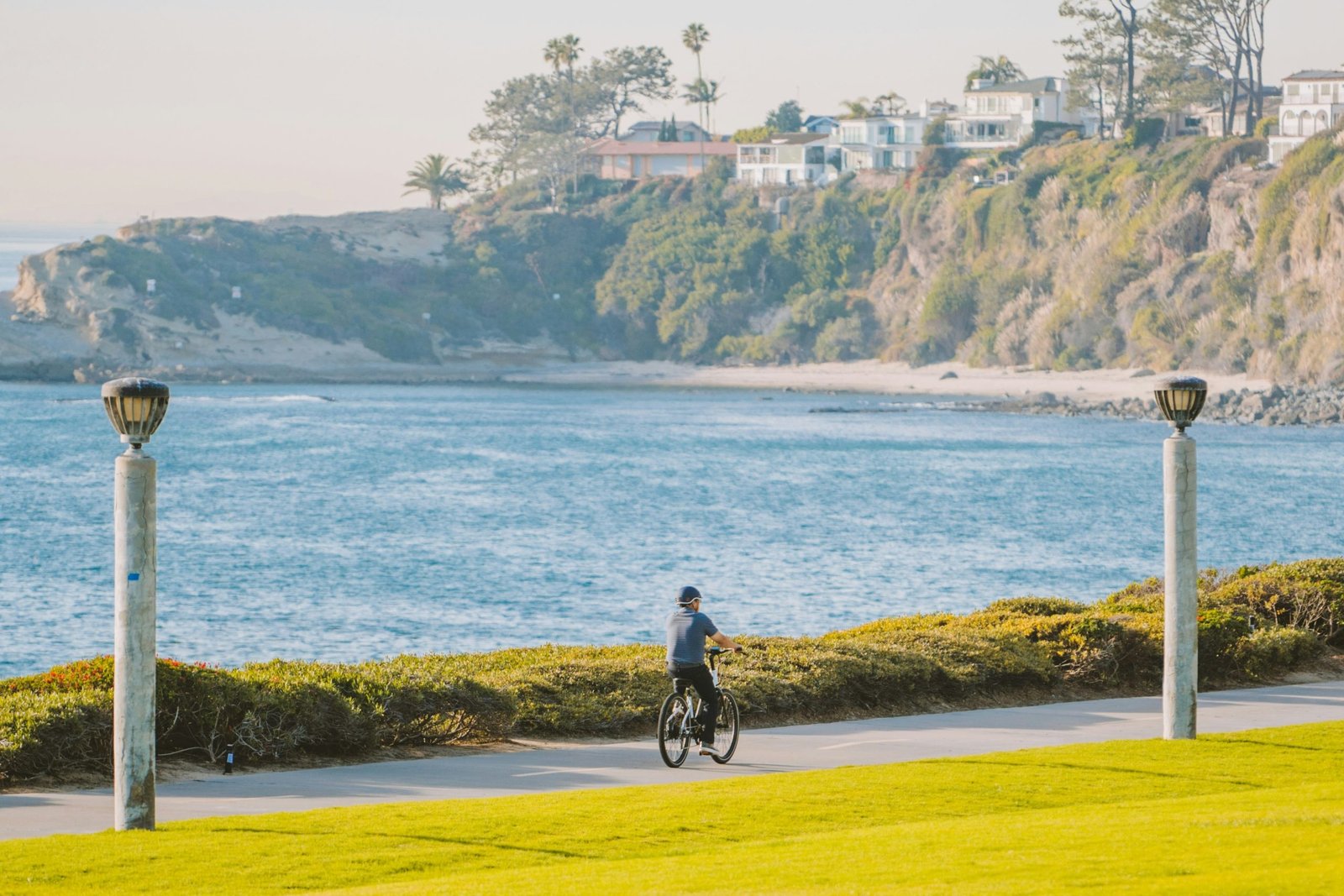 Person cycling along a scenic coastal path