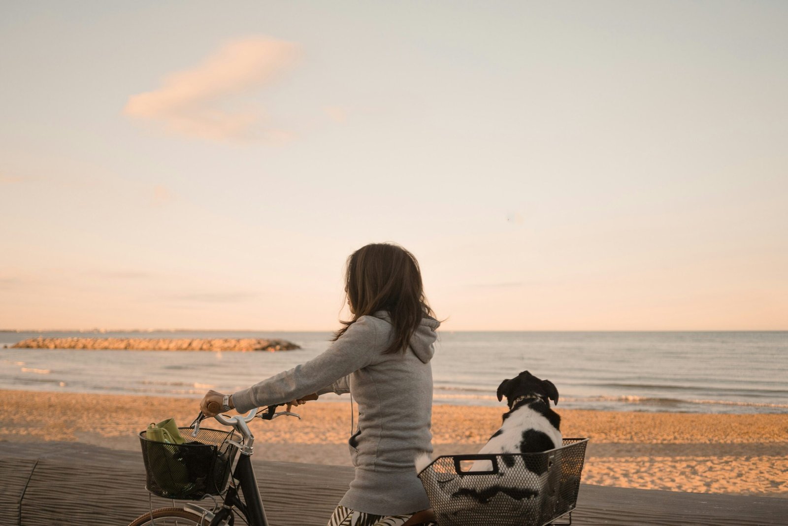 woman enjoying cycling outdoors during sunset