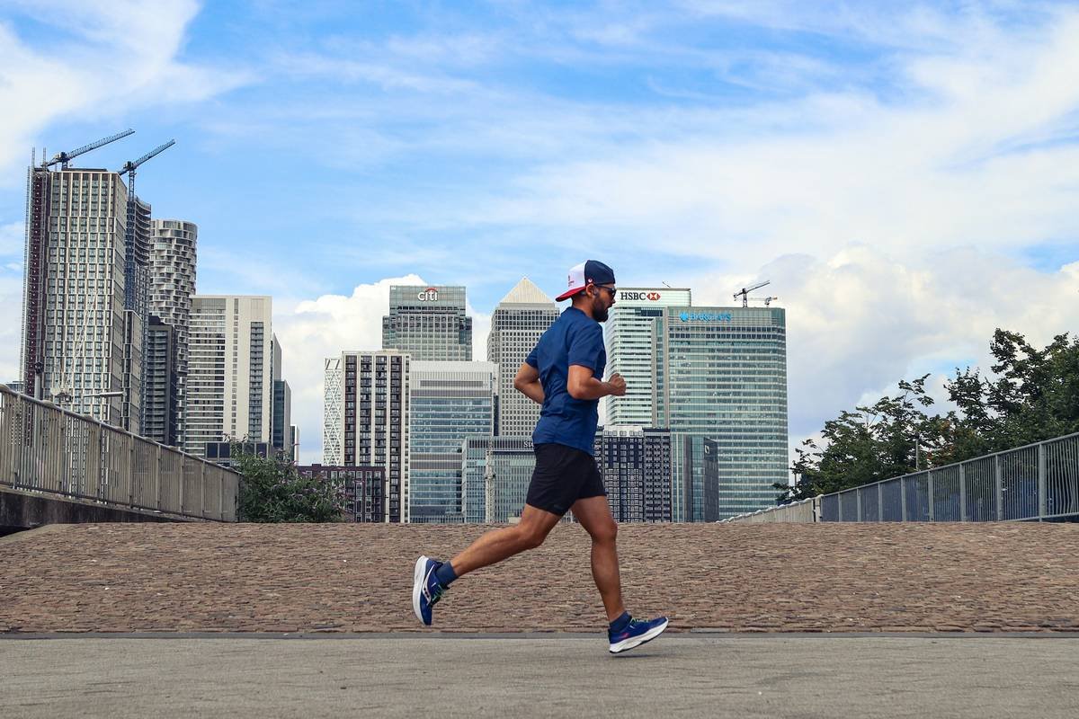 Woman cycling uphill during interval workout