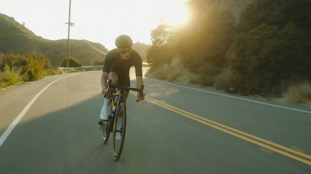 man in black t-shirt riding bicycle on road during daytime