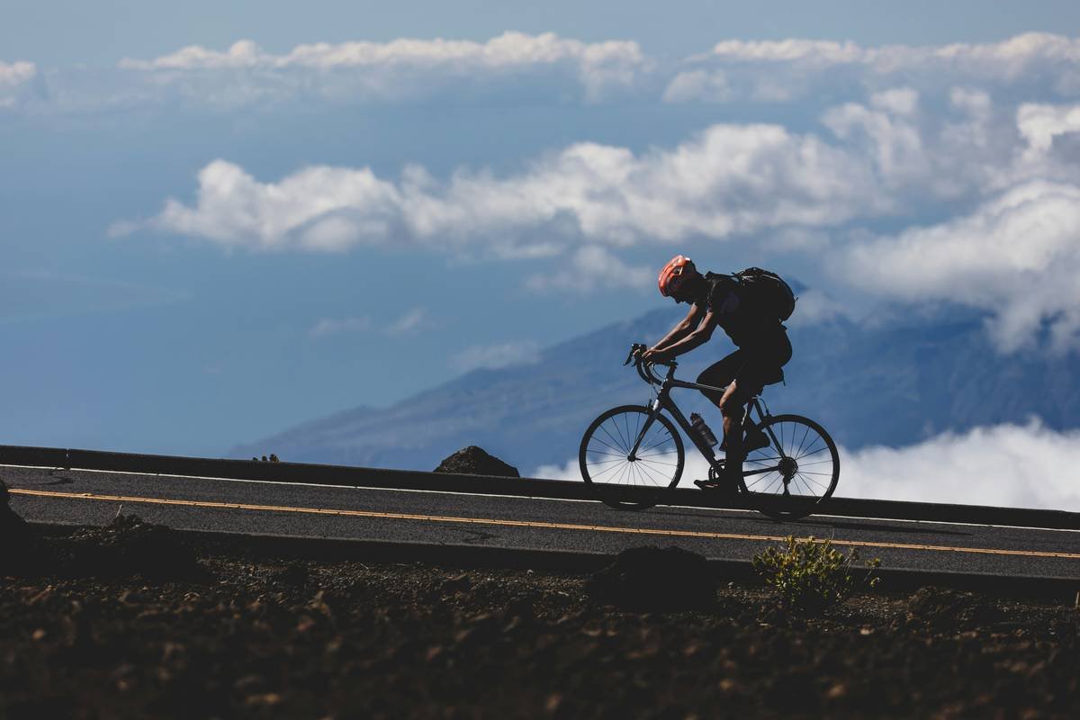 Haleakalā, Hawaii, USA - A biker makes his way to the top of the 10,000 foot volcanic summit.